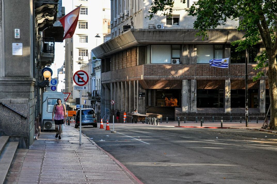 Street in Montevideo with lit windows at evening