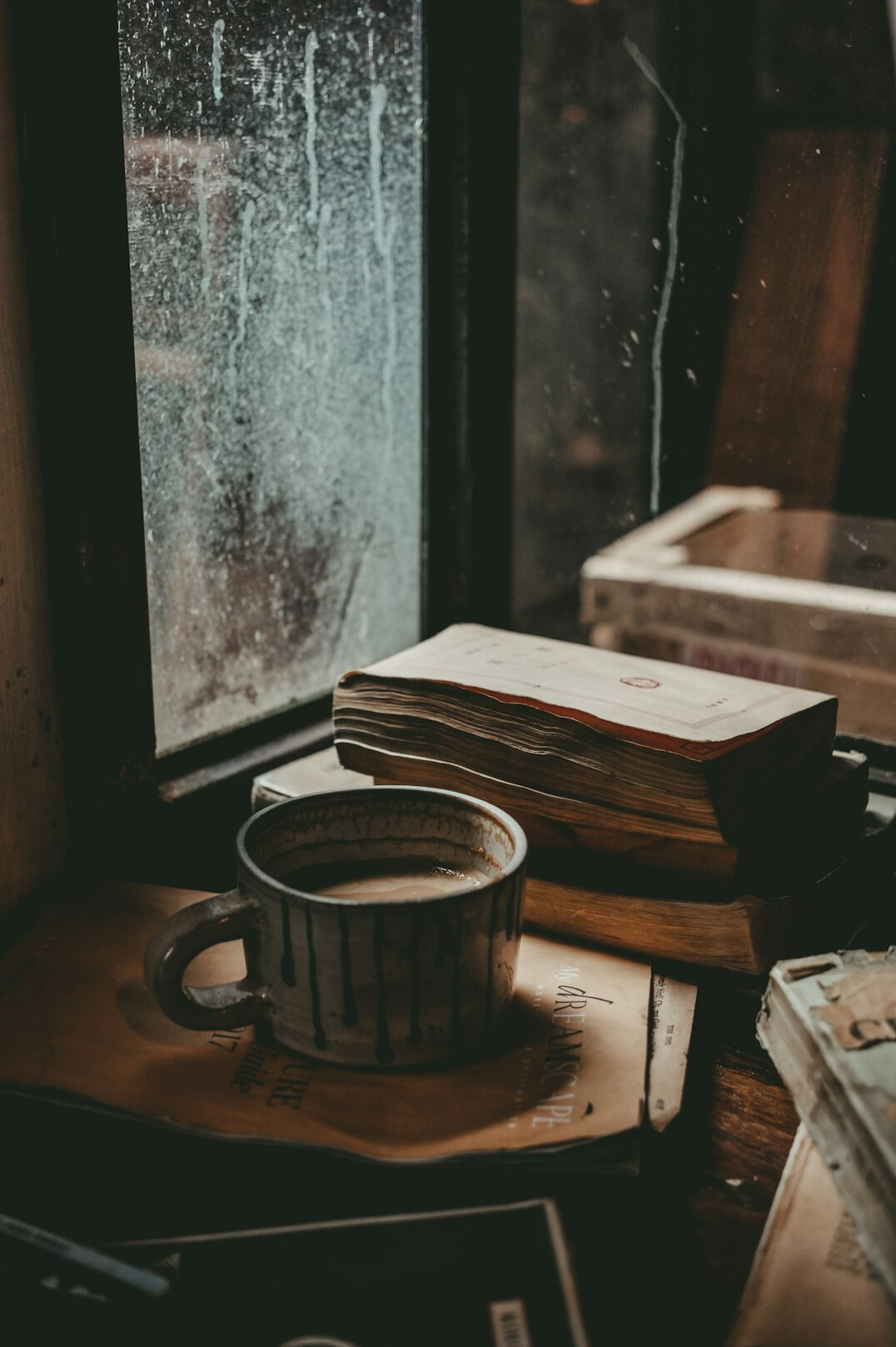 Writer's desk with papers and a cup of coffee