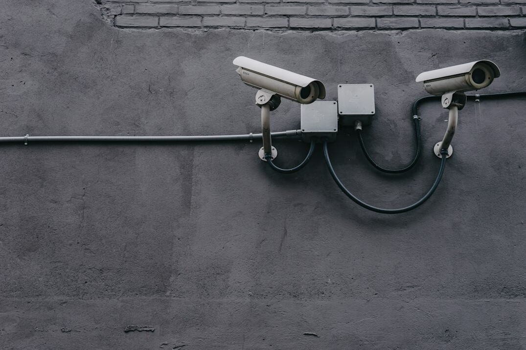 store security guard monitoring cameras