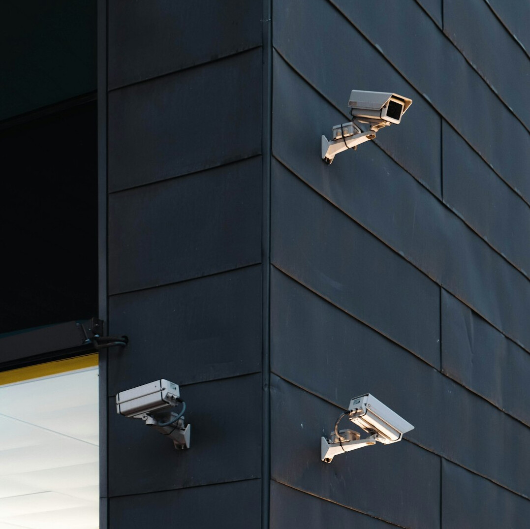 store security guard monitoring cameras
